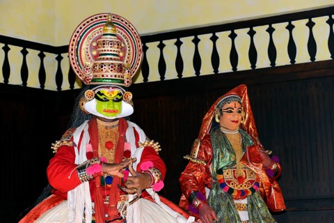 Fully made up and costumed Kathakali dancers performing