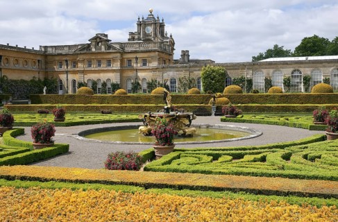 Italianate gardens with fountain and country house