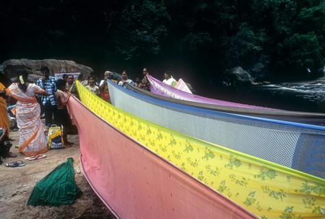 Women drying sarees after bathing Panchalinga Aruvi