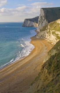 View of chalk cliffs and shingle beach