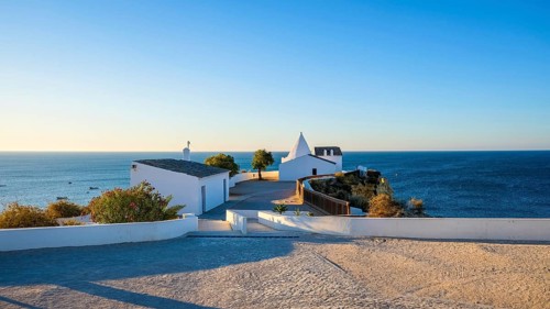 The Chapel of Nossa Senhora da Rocha on the promontory overlooking the beach of the same name. Portugal
