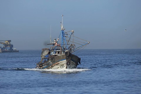 Fishing boat with beam trawls at sea