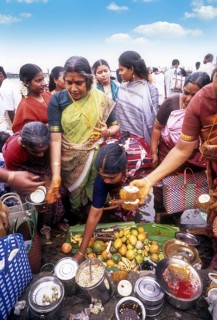 Pooja or Puja on the steps of River Kaveri or Cauvery in Srirangam
