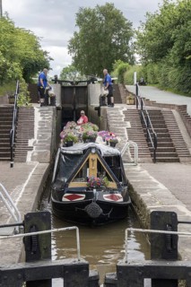 Canal or narrowboat on the Llangollen branch of the Shropshire Union Canal passes through the village of Grindley Brook using the 3 Grindley Brook locks