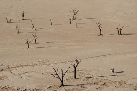 Three people in the desert