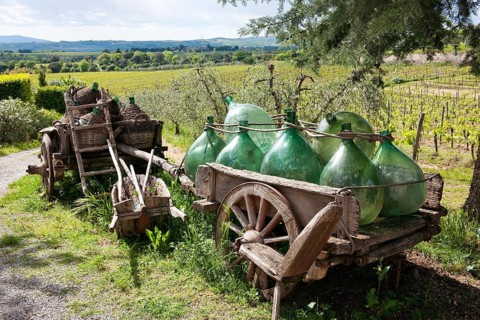 Wooden cart with wine bottles