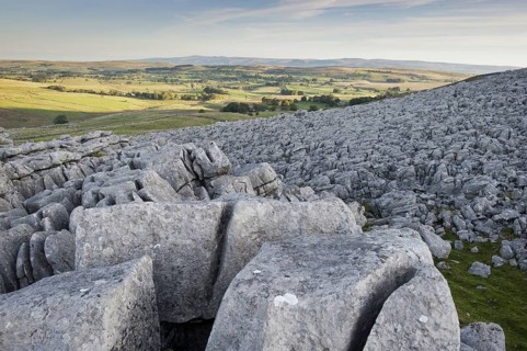 View of limestone pavement at sunrise