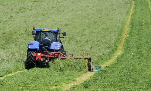 New Holland T7 tractor with Kvernland front and side mower conditioner