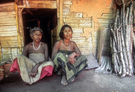 Mudunga tribal women sitting in front of the hut a tribal village near Silent Valley