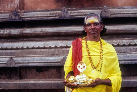V. Moorthy â€“ Beggar standing with idol naga