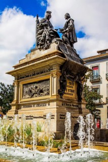 Monument with Columbus and Queen Isabella I of Castile in the Plaza de Isabel la Catolica in Granada
