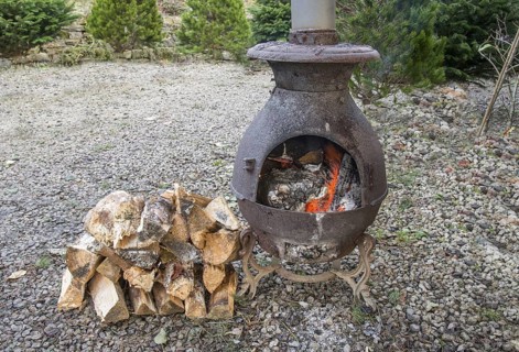Wood stove burning split logs