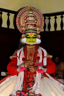 Fully made up and costumed Kathakali dancer performing