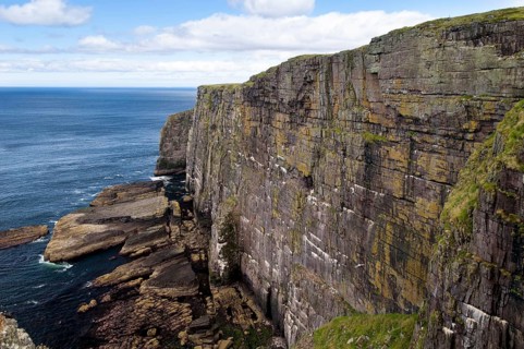 View of Torridonian red sandstone sea cliffs in northwest of island