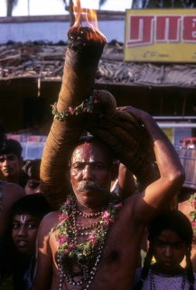 Devotee fulfilling vow during Karamadai chariot festival near Coimbatore