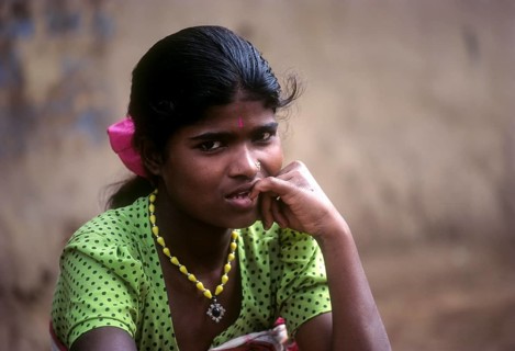 Betta Kurumba tribal girl sitting the tribal village