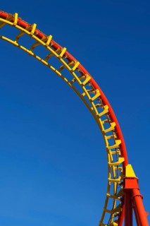 Roller coaster in front of blue sky