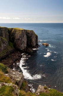 View of Torridonian red sandstone sea cliffs in northwest of island