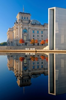 Reichstag and Paul-Loebe-Haus reflected in the Spree at sunrise