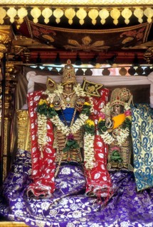 Decorated urchava deity Lord Subramanya and Goddess Deivanai or Devasena in Tirupparankundram or Thiruparankundram temple near Madurai