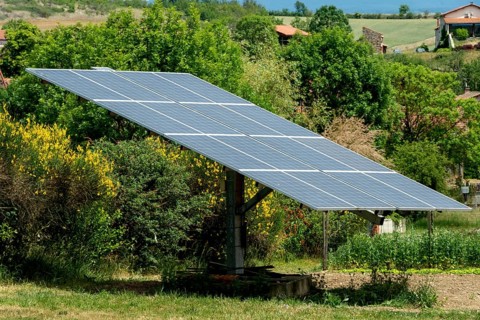Solar panels in a garden. Auvergne Rhone Alpes. France