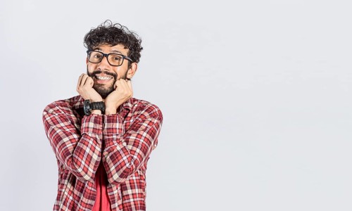 Handsome man in glasses smiling kindly