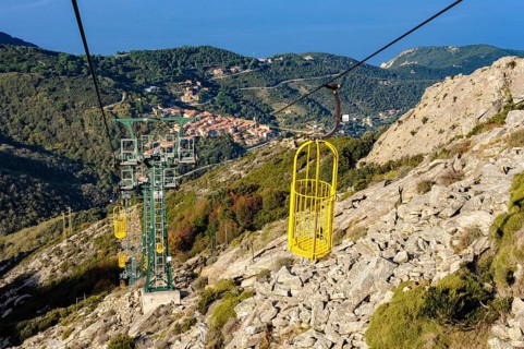 Cable car Cabinovia Monte Capanne with open gondola Cable car gondola standing gondola on mountain Monte Capanne