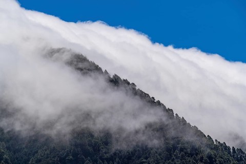 Trade wind clouds streaming over the mountains of Cumbre Nueva