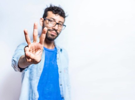 Portrait of people counting number three on isolated background. Person hand counting number three. Handsome guy hand showing number three