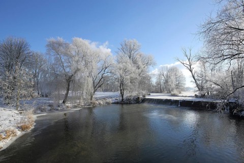 Winter landscape on the Jagst with hoarfrost and snow