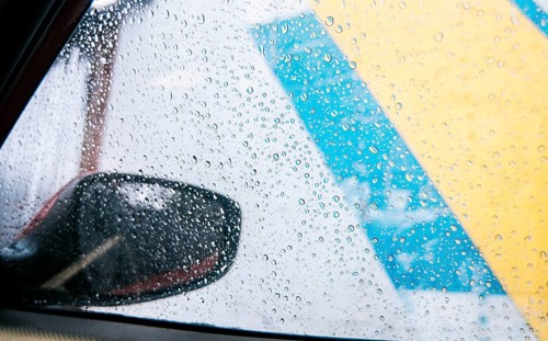 Raindrops on the side window of a car