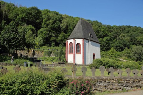 Gothic cemetery chapel Dreikoenigskapelle at the cemetery with graves in Gondorf