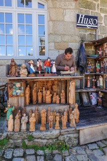 Carvers of Breton figures in the village square
