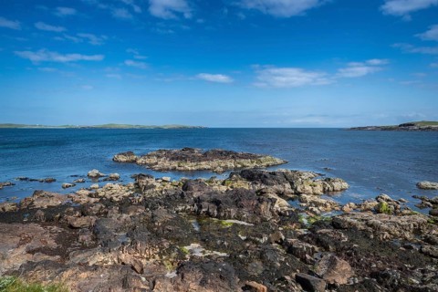 Coastal scene with view of the island of Papa Stour