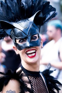 Costumed laughing woman from the SM scene