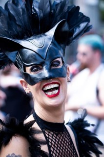 Costumed laughing woman from the SM scene