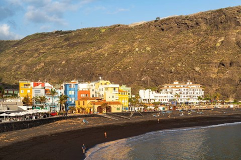 Lava beach and colourful houses in Puerto de Tazacorte