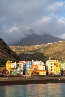 Lava beach and colourful houses in Puerto de Tazacorte