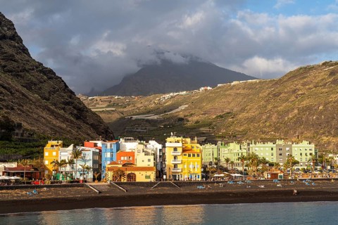 Lava beach and colourful houses in Puerto de Tazacorte