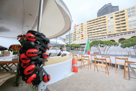 Chairs set up for the spectators on the quarterdeck of a motor yacht at the race track