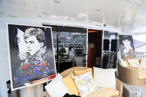 Sofas and paintings with racing drivers and racing cars