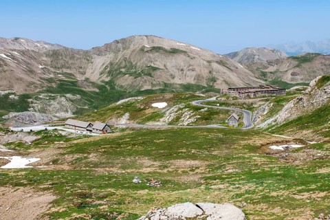 View of alpine high plateau with historic Fortin Fort Garrison Caserne de Restefond on the right