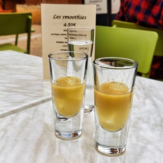 Two glasses of Pastis with ice on a table in the restaurant