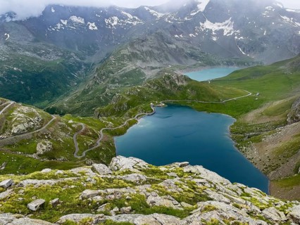 View from panoramic point at Colle del Nivolet on Lago Agnel in front