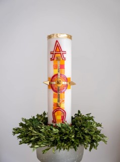 Large candle with alpha and omega signs in Germany's first private ecumenical motorway church 'Geiselwind Licht auf unserem Weg' on the A 3 between Wuerzburg and Nuremberg