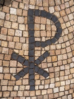 Orthodox cross on the pavement leading to the entrance of Germany's first private ecumenical motorway church Geiselwind Light on our way on the A 3 between Wuerzburg and Nuremberg