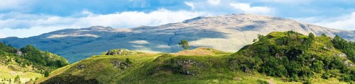 Panorama of Mountains in Lights and Shadows over Glenfinnan Viaduct