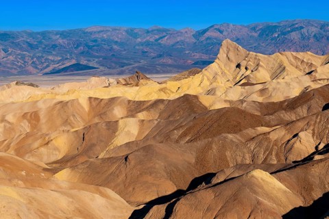 Coloured rock formations in the evening light at Zabriskie Point