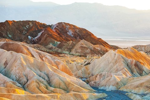 Coloured rock formations in the evening light at Zabriskie Point
