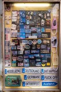 Signs and knick-knacks for tourists in a shop window of a shop in the old town of Heidelberg. The shop is closed due to the Corona pandemic